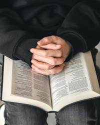 A person holding a book

AI-generated content may be incorrect.